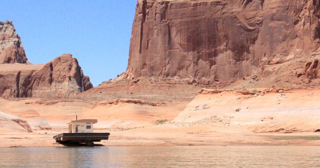 Lake Powell's dropping water level reveals pickup, human remains