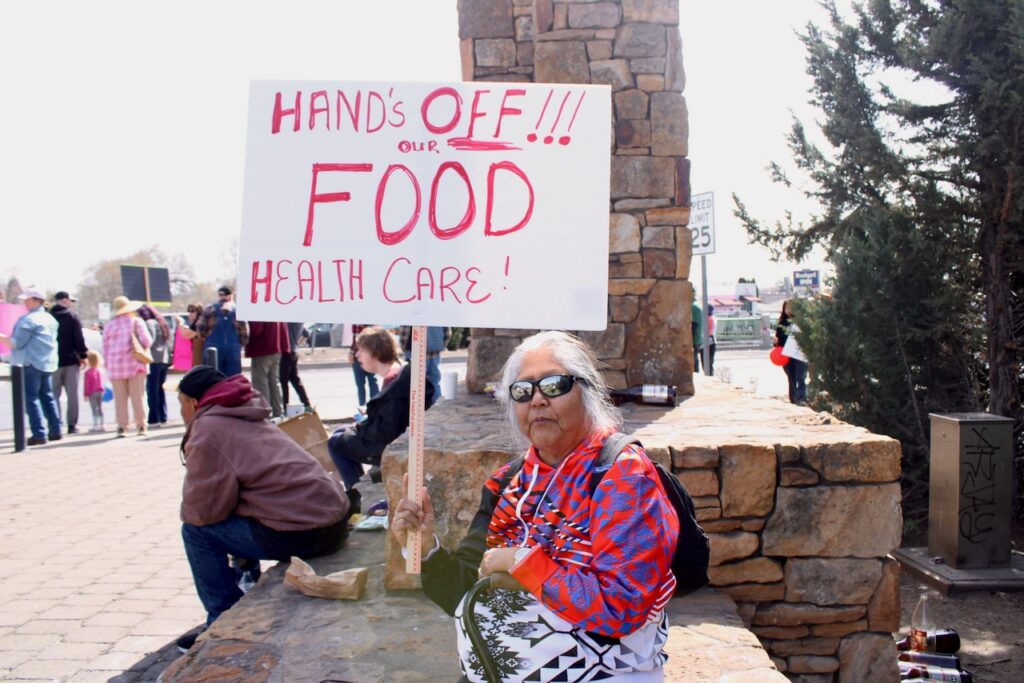 Lucy Suppah, a member of the Confederated Tribes of Warm Springs, attends a protest in Madras on Saturday, April 5, 2025. (Photo by Julia Shumway/Oregon Capital Chronicle)