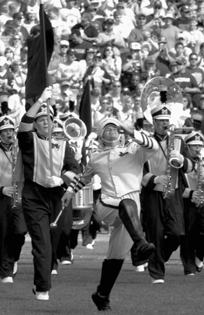 England leading the Michigan Marching Band in the fall of 2001.