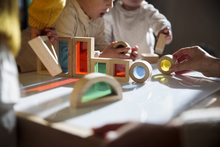 Children playing with colorful wooden building blocks. (Getty Images)