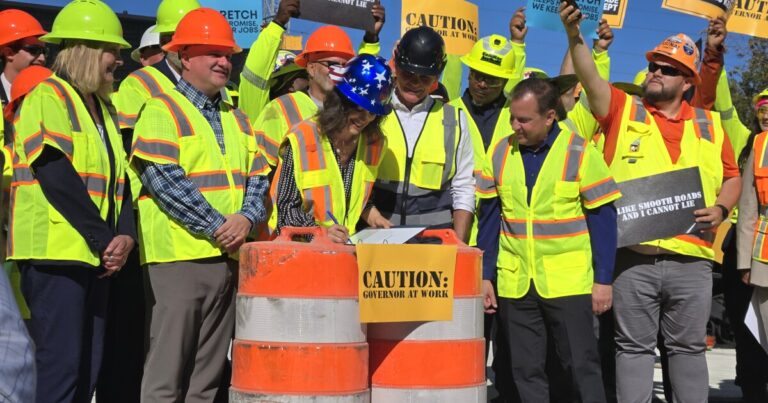 Whitmer ceremonially signs road funding bill