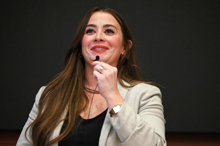 Melinda Reed speaks at a forum