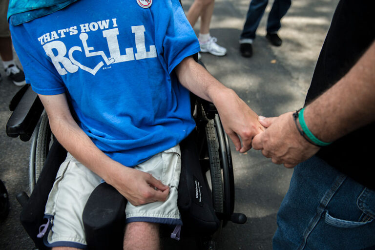 A father holds his son