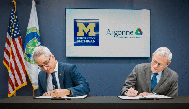 University of Michigan Argonne NL Partner for Maritime Innovation - Kitchen Table News Two men sitting at a table sign papers