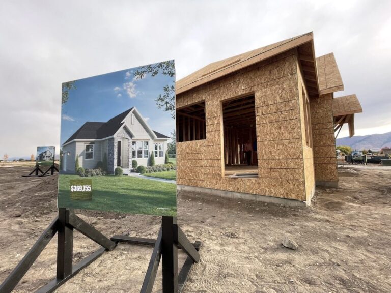 A rendering for a starter home being constructed sits on display during a groundbreaking ceremony for The Orchards at JDC Ranch in Utah.