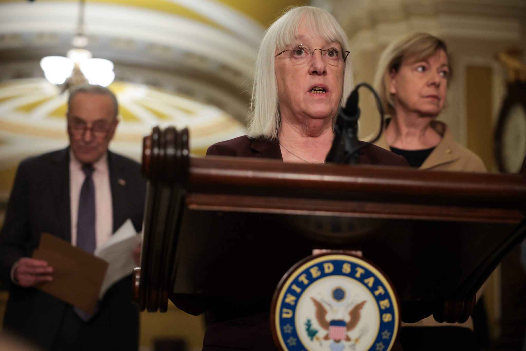 Washington state Democratic Sen. Patty Murray speaks to reporters at the U.S. Capitol on Feb. 25, 2025. Senate Democratic Leader Chuck Schumer and Sen. Tammy Baldwin, Democrat of Wisconsin, stand behind her. (Photo by Kayla Bartkowski/Getty Images)