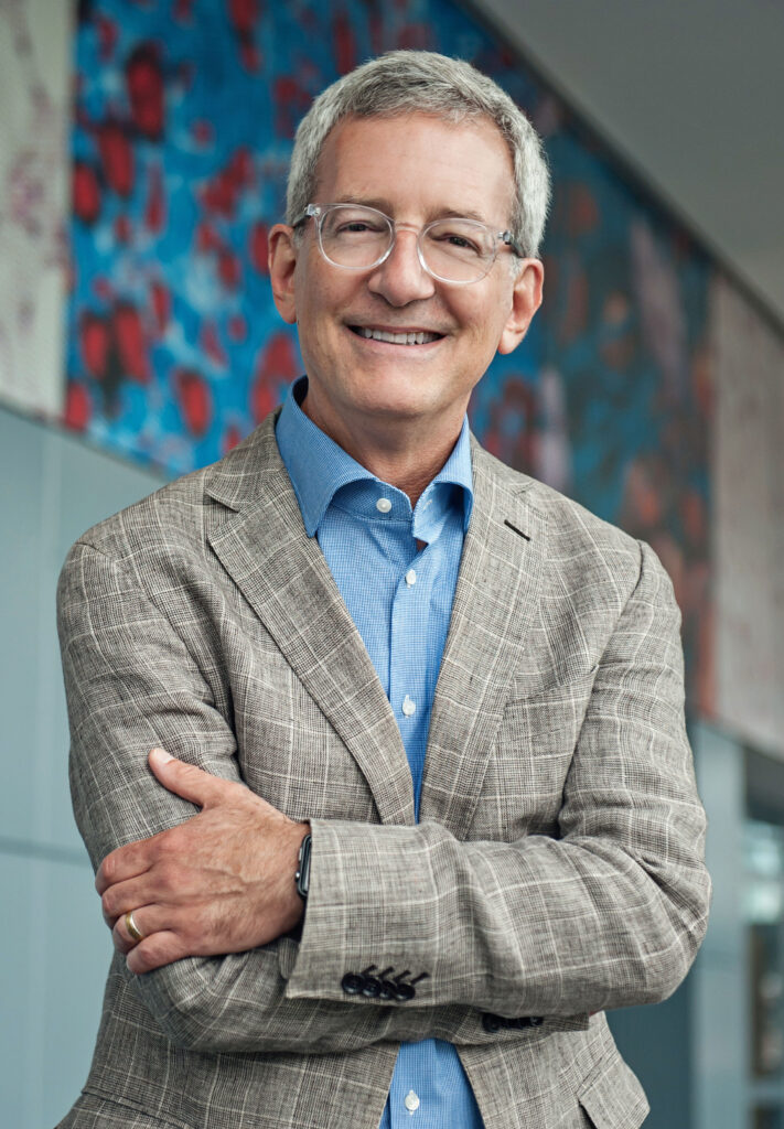 Man in sportcoat looking at camera