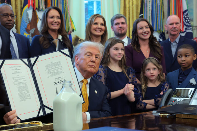 President Donald Trump displays a signed bill in the Oval Office on Jan. 14, 2026. Trump signed the Whole Milk for Healthy Kids Act, which restores whole milk to school lunches across the country. (Photo by Anna Moneymaker/Getty Images)
