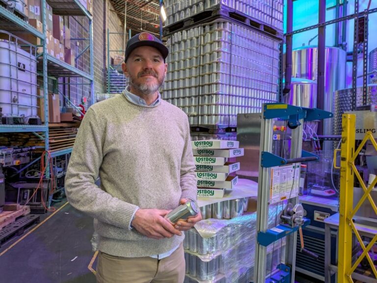 Tristan Wright, founder and president of Lost Boy Cider, stands near his production line on Feb. 6, 2026, in Alexandria, Virginia. (Photo by Ashley Murray/States Newsroom)