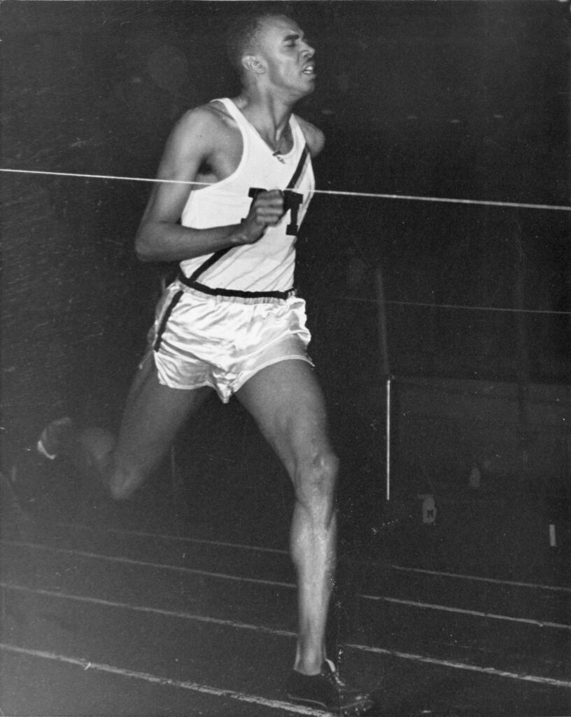 Val Johnson running the 440-yard race vs. Michigan State at Yost Field House in 1948