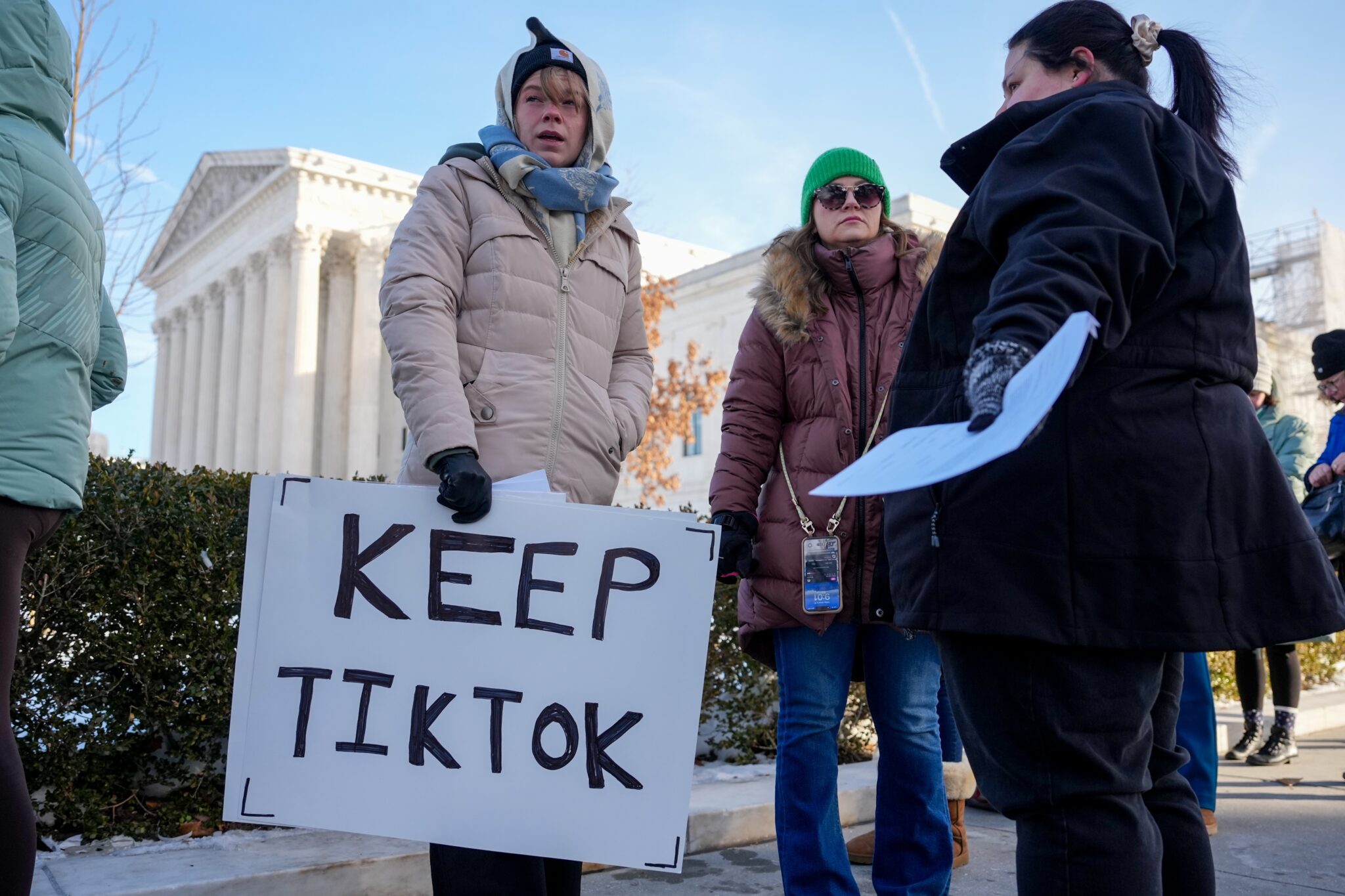 Montana TikTok Ban Lawsuit Dismissed After Sale to US Consortium - Kitchen Table News Sarah Baus of Charleston, S.C., holds a sign that reads