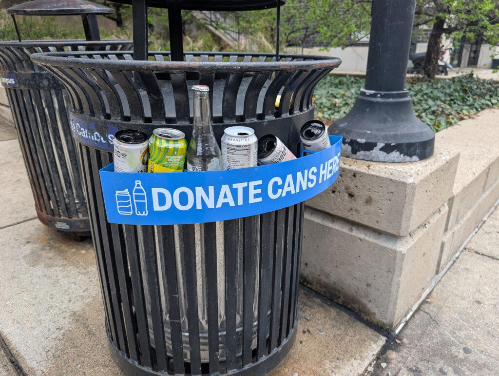 A trash bin with a shelf for returnable bottles and cans