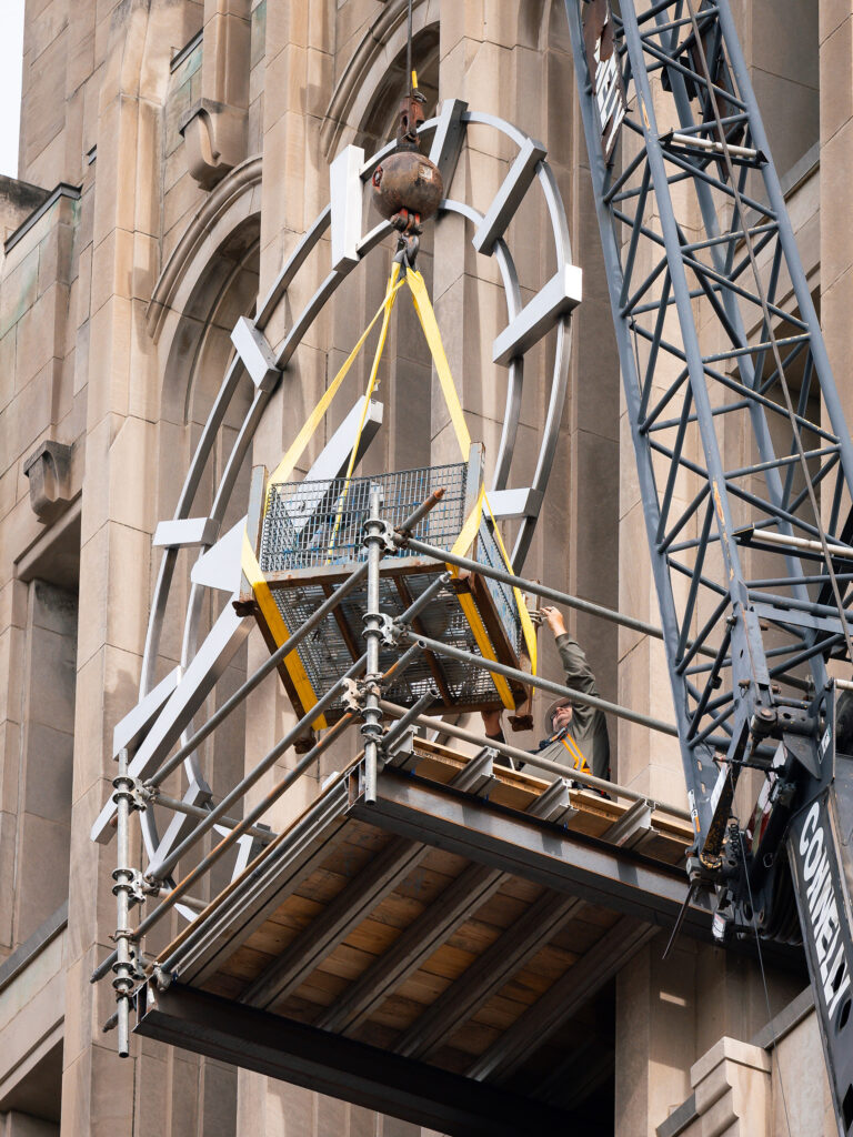 Crews used a crane and basket to remove 26 clappers from Burton Tower on May 22