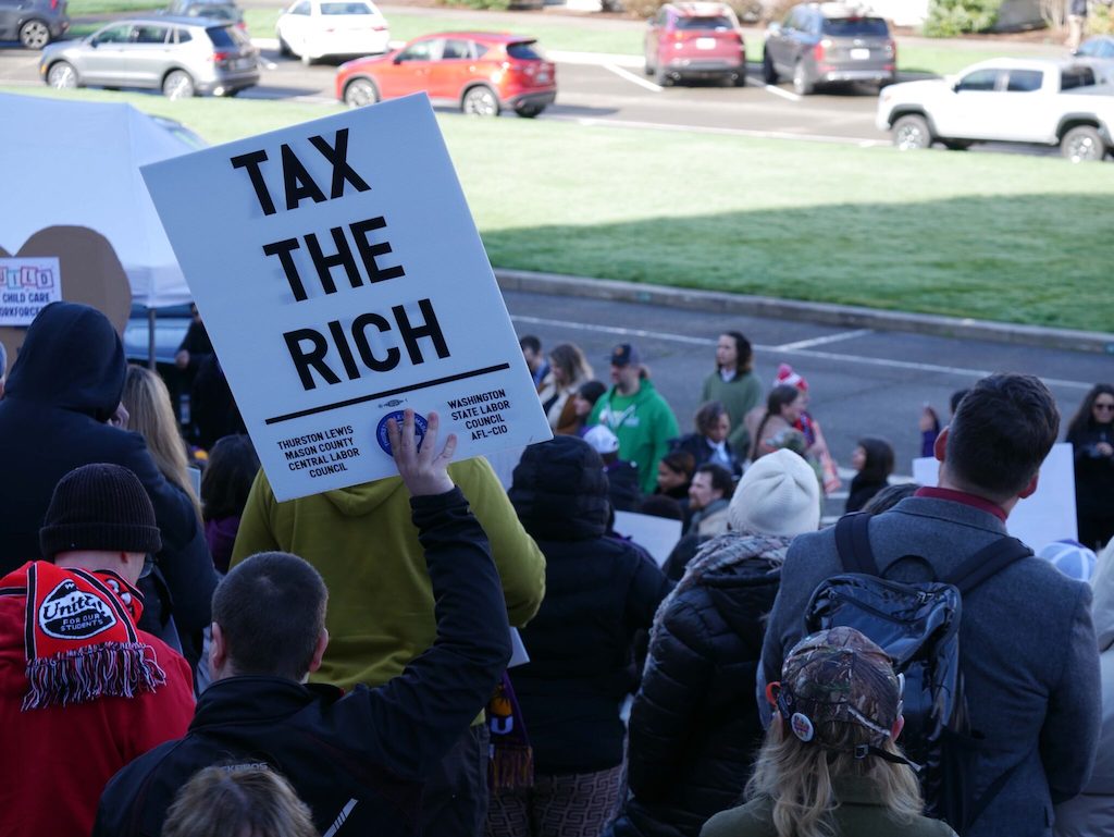 Labor unions and other supporters of an income tax on millionaire earners rallied at the Washington state Capitol in Olympia in February. A growing number of liberal states are considering raising taxes on their wealthiest residents.