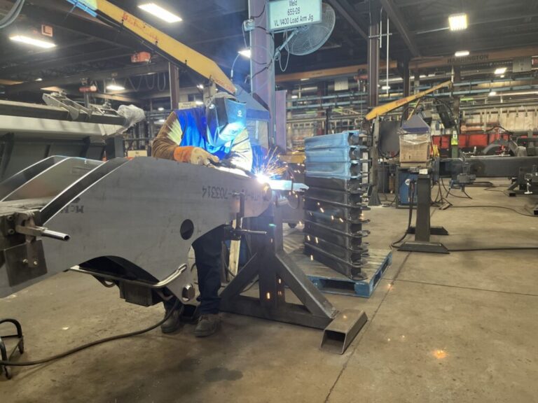 A welder works at a Manitou factory in June 2023 at Madison, South Dakota. Labor shortages in North Dakota and South Dakota could be harbingers of a shortage of young people in coming years. (Photo by Joshua Haiar/South Dakota Searchlight)
